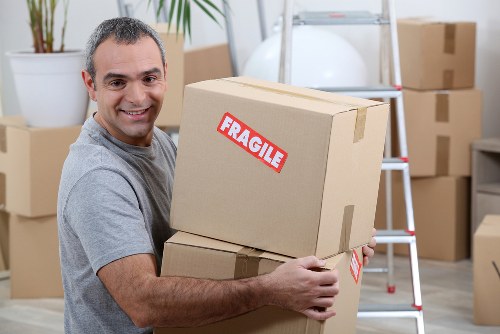Local movers loading household items for transport near Kensal Green