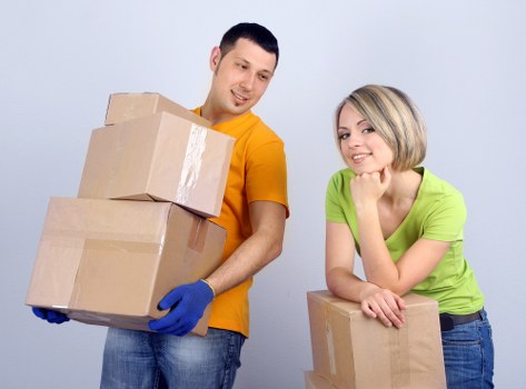 Packed boxes and removal van ready for transport
