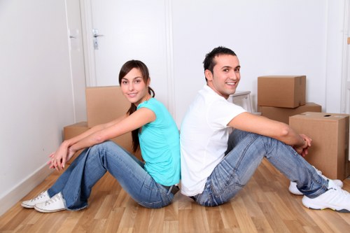 Unpacking service helping a family settle into a new flat