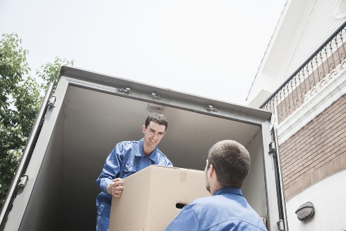 Packed boxes and furniture ready for local removals in a Kensal Green home