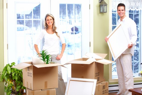 Mover carrying furniture at a Kensal Green property